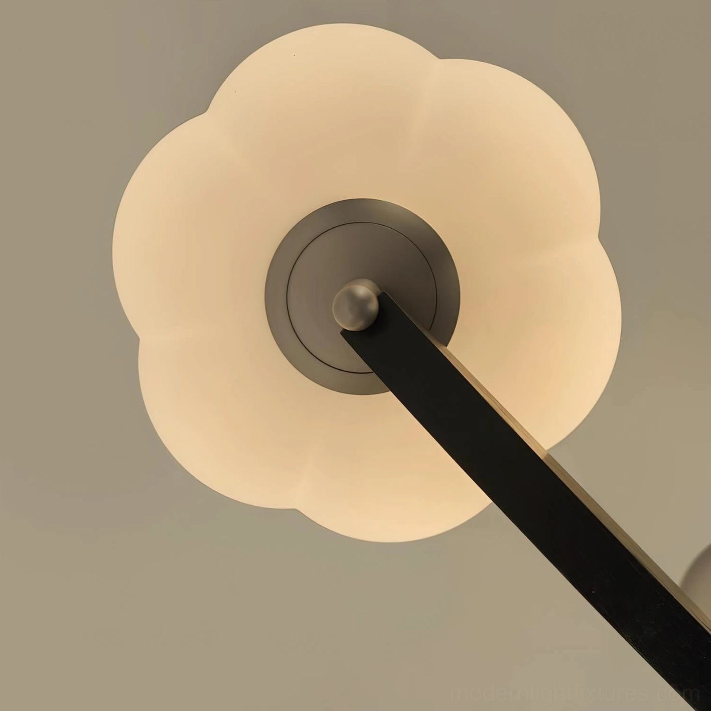 Modern cloud glass pendant chandelier installed in contemporary dining room above wooden table, warm lighting ambiance