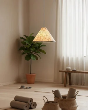 Single beige rice paper pendant light in wabi-sabi inspired relaxation corner with warm ambient lighting