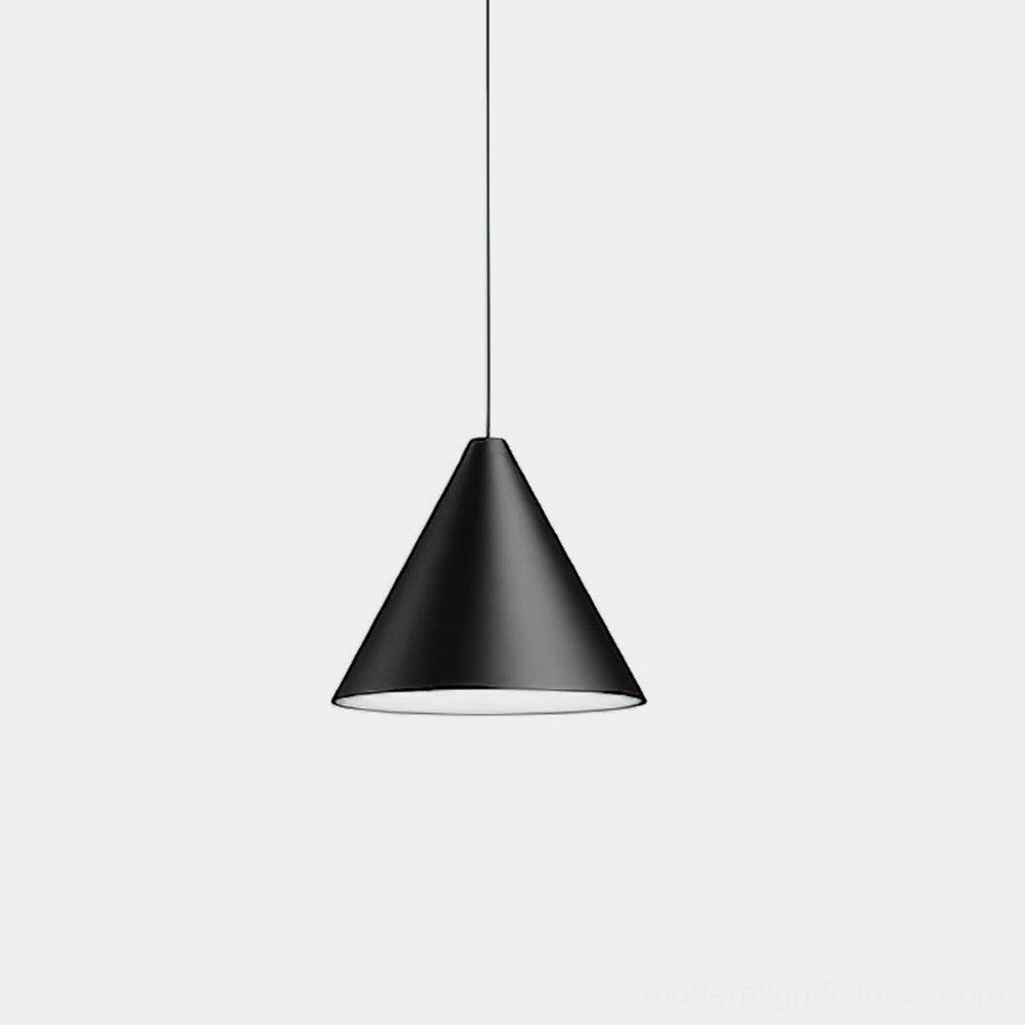 Modern black cone pendant light with exposed cable, minimalist metal shade in studio setting, Scandinavian industrial design