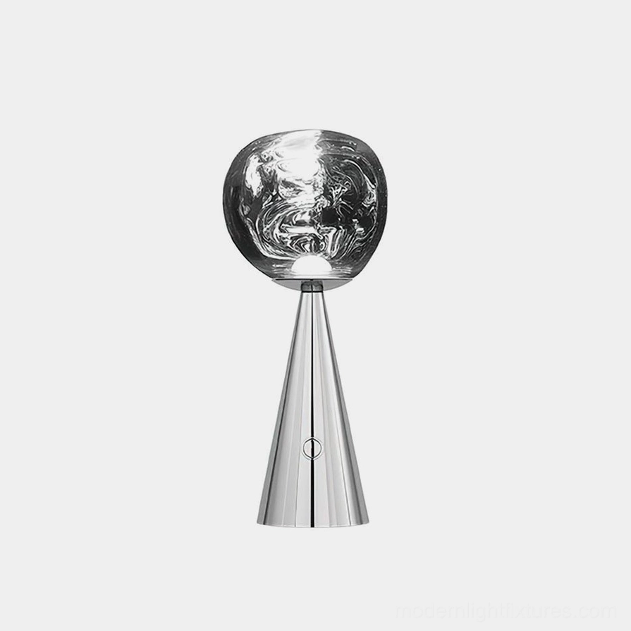 Modern conical table lamp with polished silver metal base and marbled smoked glass shade, studio front view showcasing contemporary design