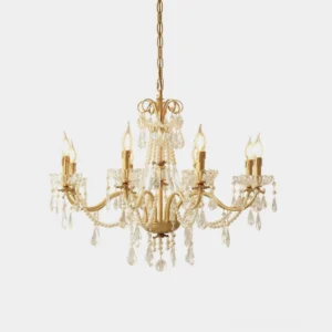 Modern crystal chandelier with brass frame hanging against white studio background, showcasing clear crystal pendants and gold-toned hardware