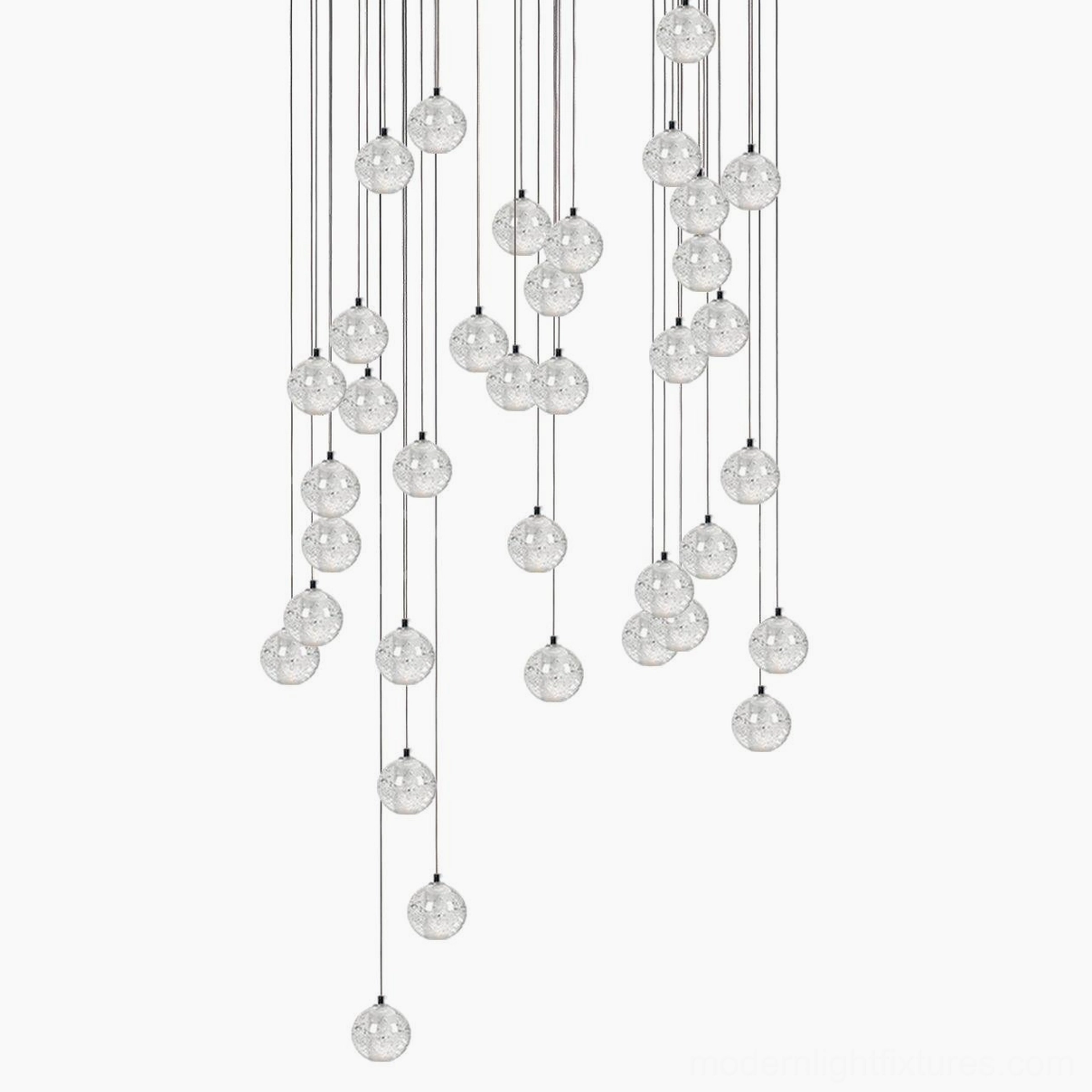 Modern crystal pendant light installation showing proper height and positioning over workspace