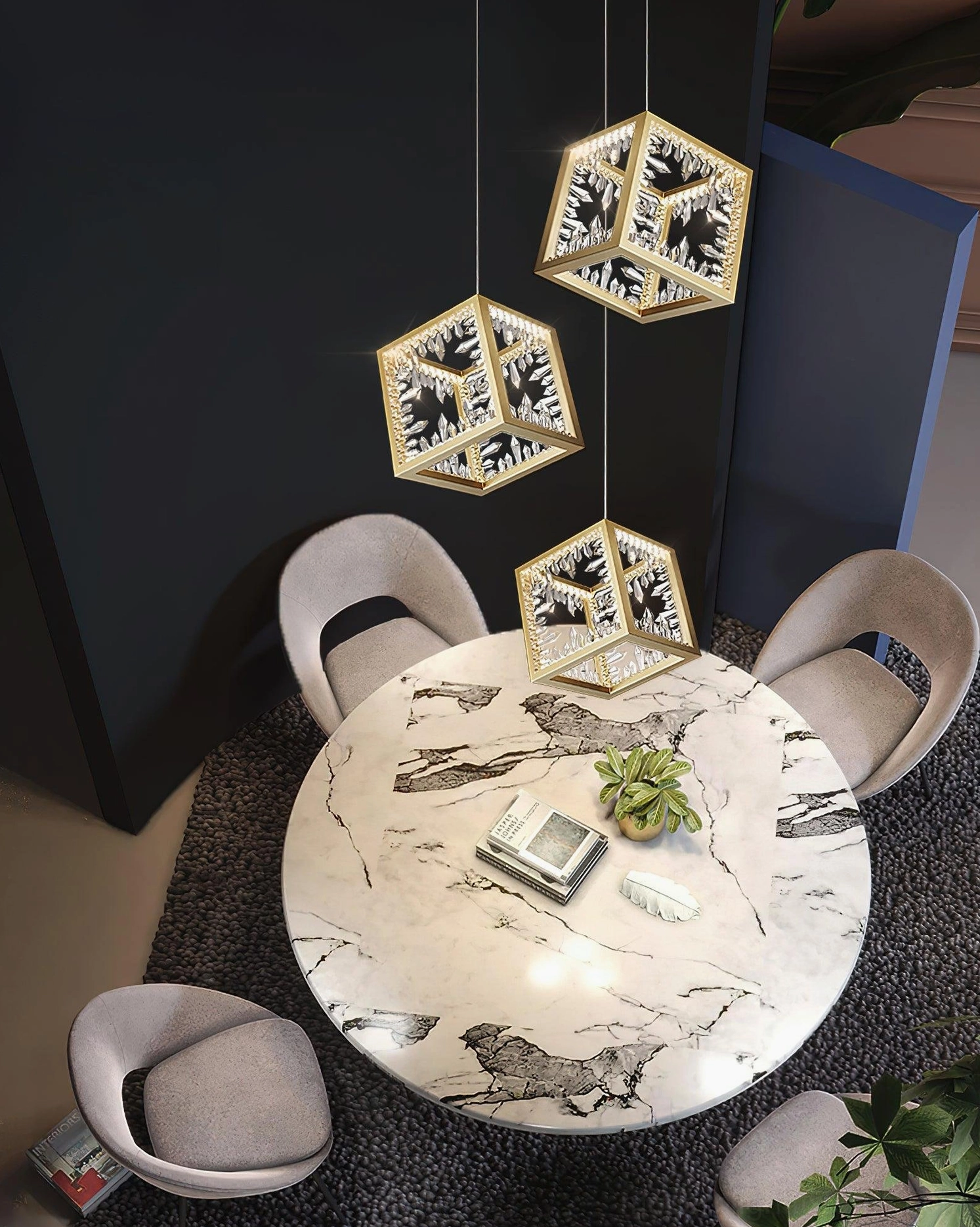 Multiple gold cube pendant lights hanging over marble dining table in contemporary interior