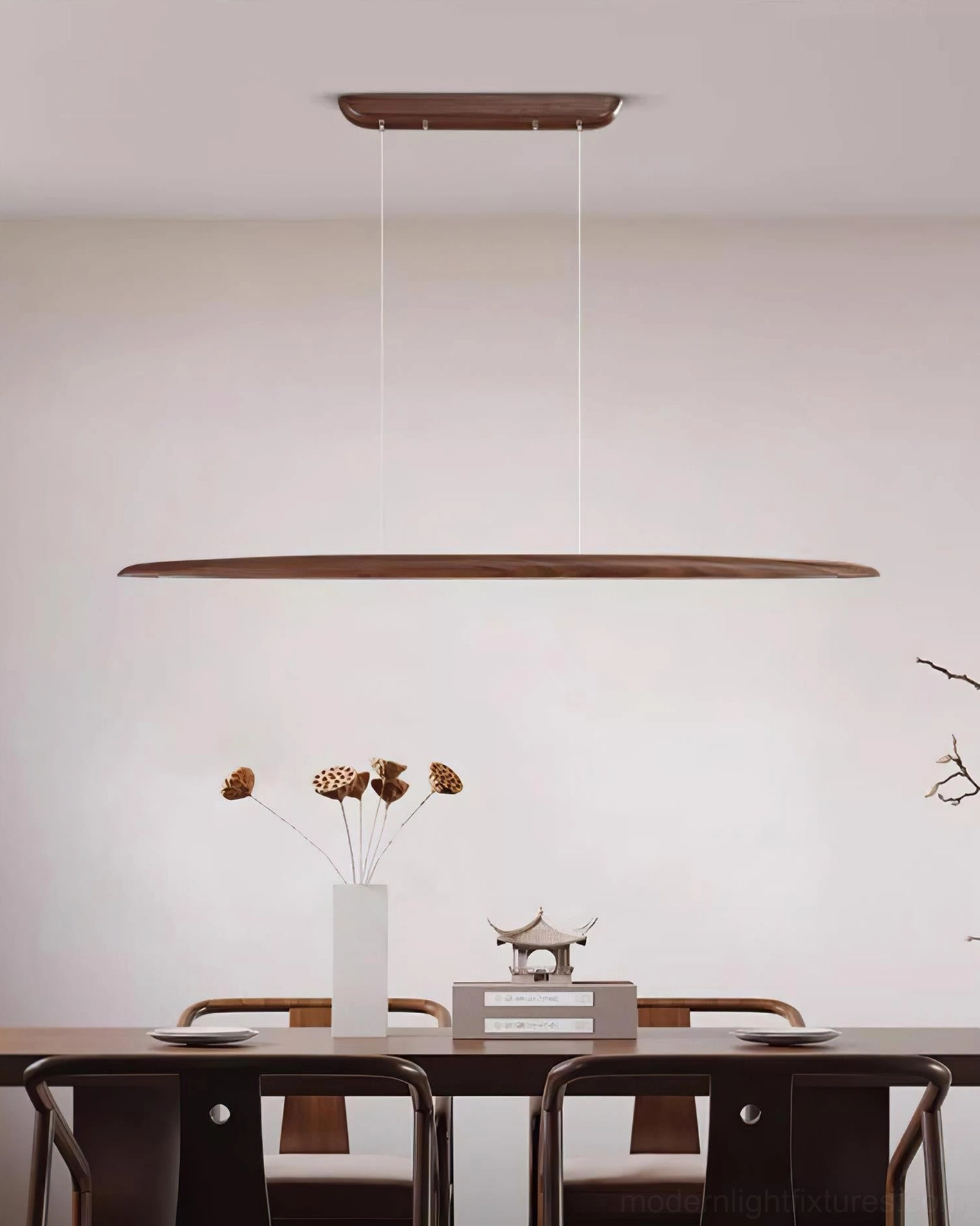 Contemporary minimalist dining area with linear wood LED chandelier and simple table decoration