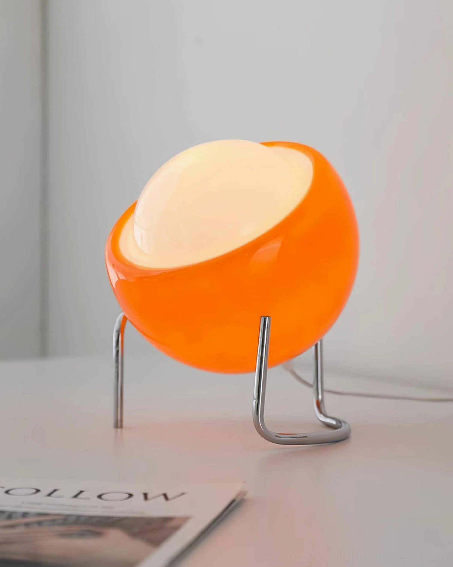Modern dome table lamp in minimalist interior setting, accent lighting on side table design