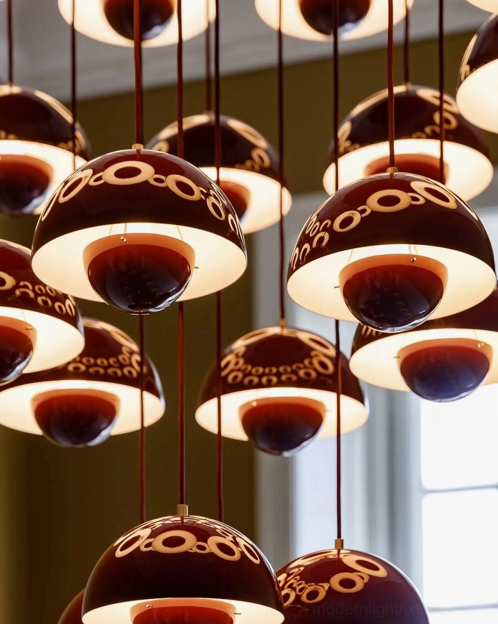 Modern dome pendant chandelier with varied height suspension showing contemporary sculptural lighting design in residential setting