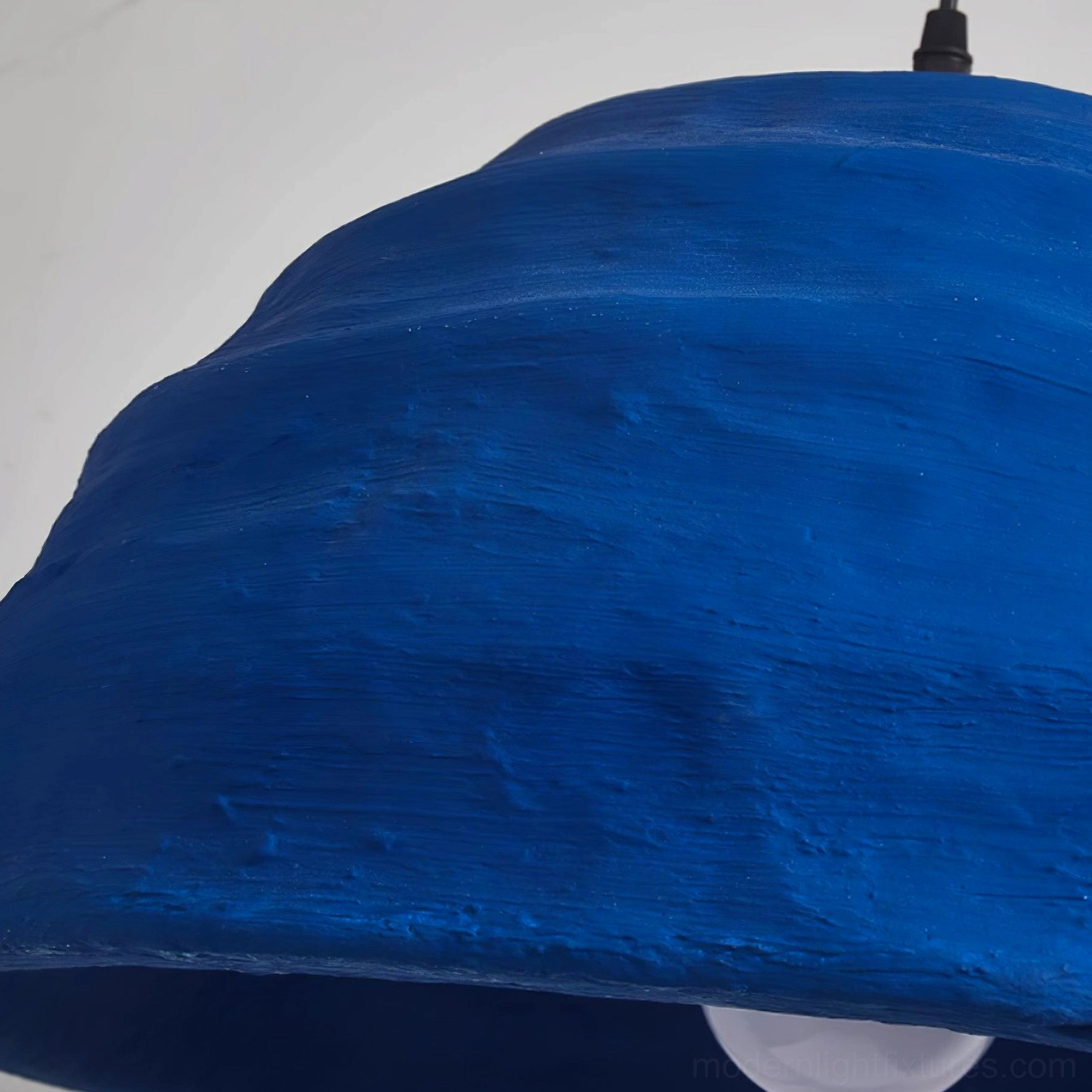 Modern dome pendant lamp installation in residential interior with architectural context