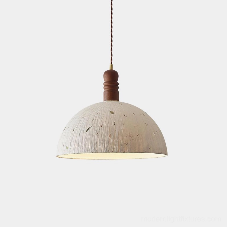 Handcrafted rice paper dome pendant light with organic leaf patterns and wooden top cap, frontal studio view