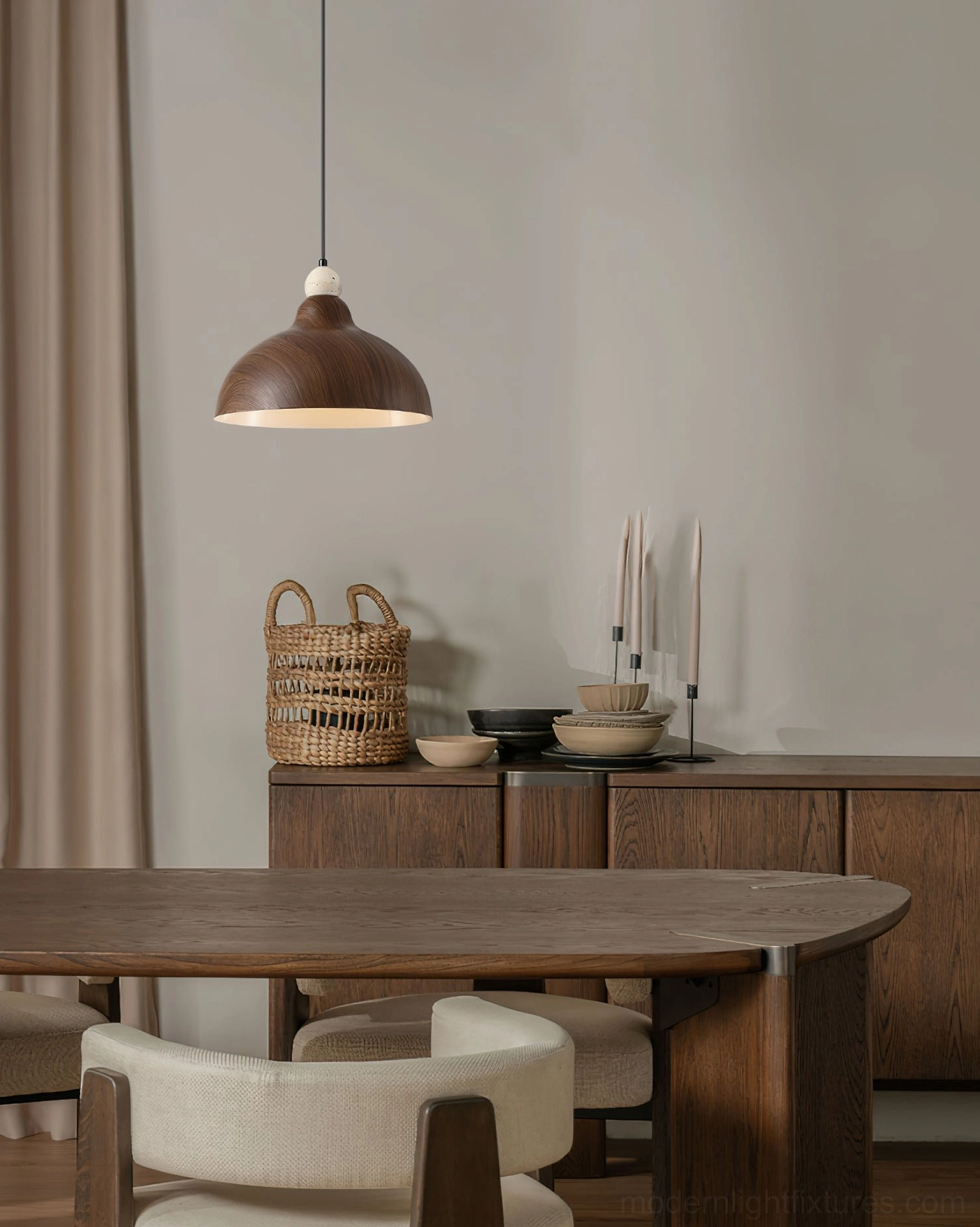 Modern wood-grain hanging lamp in traditional wooden dining space with woven decor
