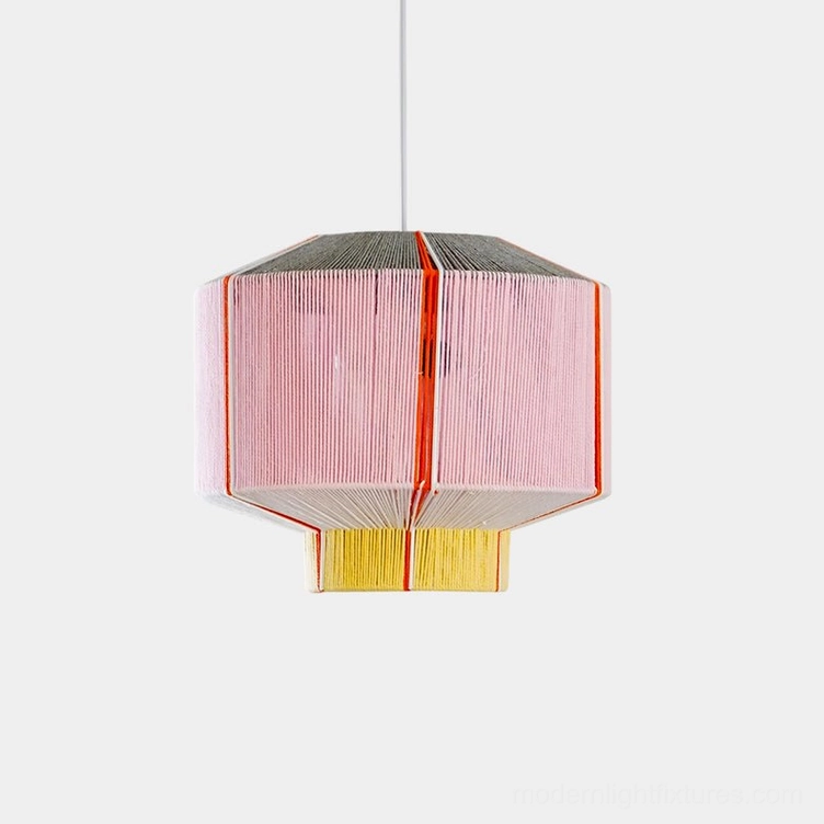 Colorful geometric faceted pendant light with pink, yellow and grey cotton thread shade on white background