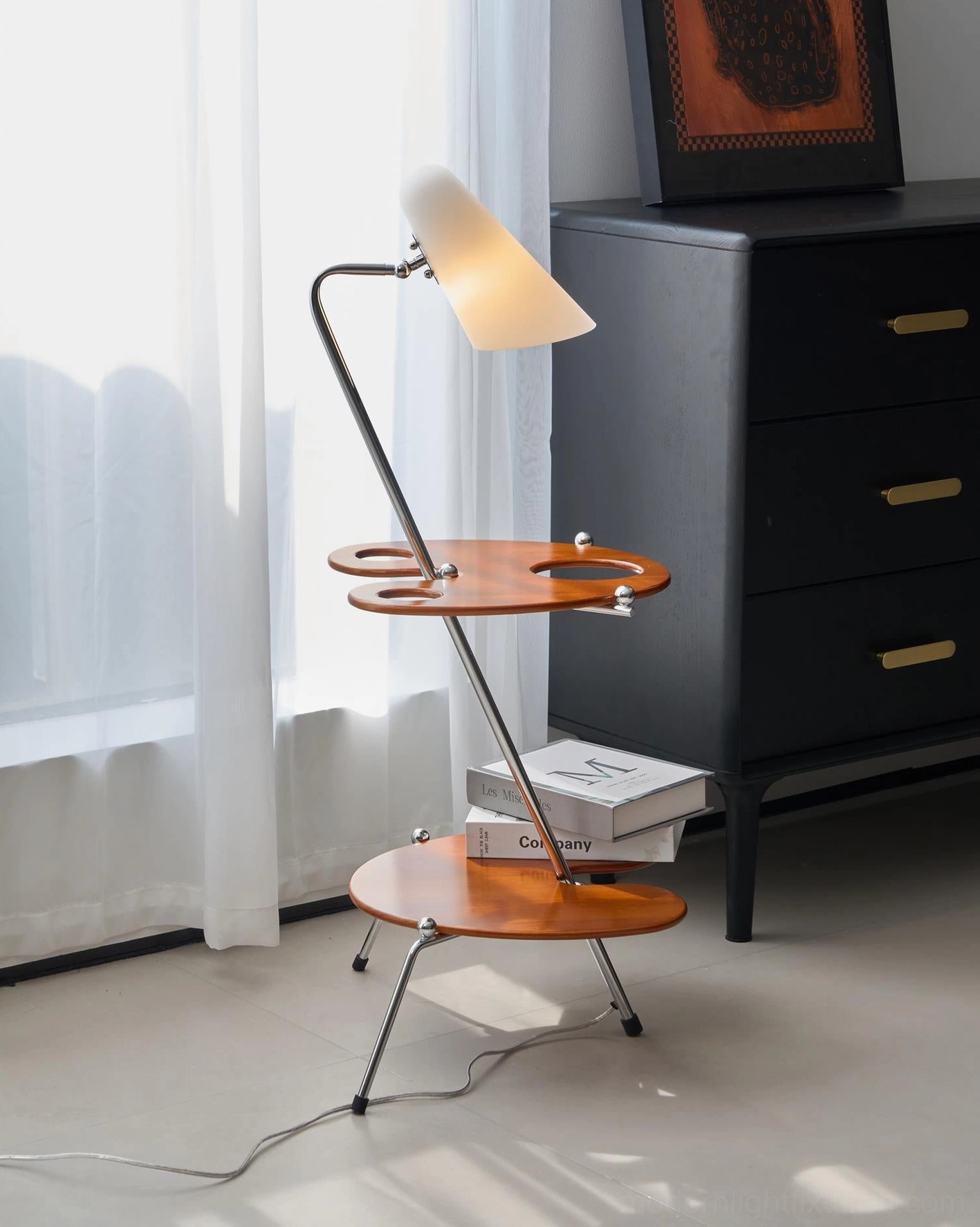 Designer floor lamp with beige fabric shade and tiered wood storage shelves in minimalist living space