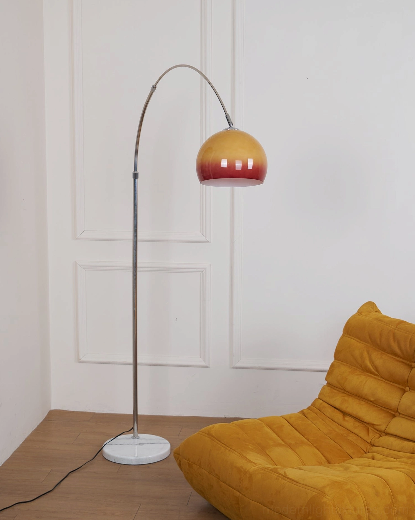 Modern floor lamp with ombre gradient spherical shade and polished chrome arched frame
