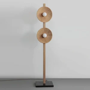 Sculptural twin disc floor lamp with fluted wooden pole and layered disc shades close-up detail shot