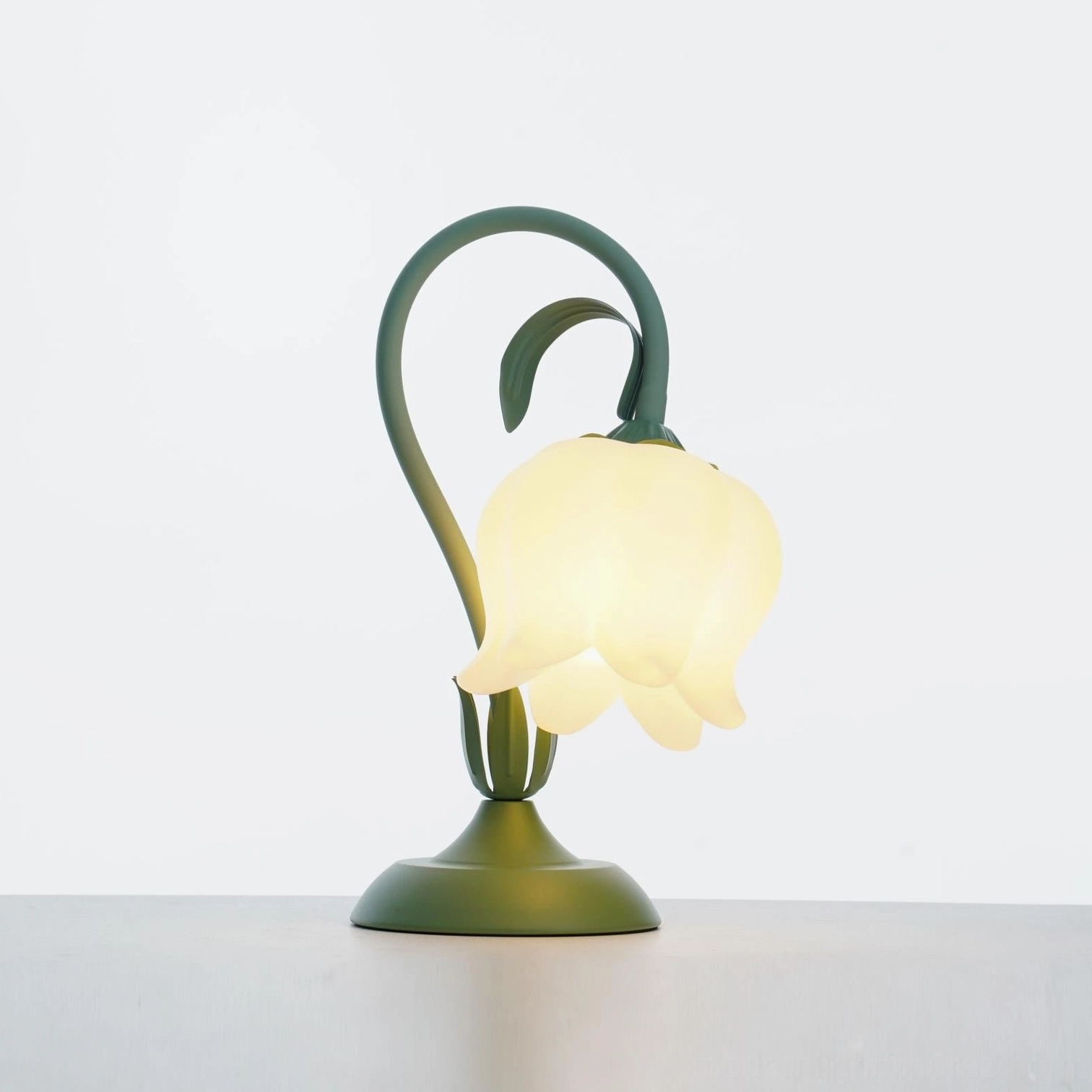 Modern floral table lamp with metal frame, acrylic accents, and stable weighted base