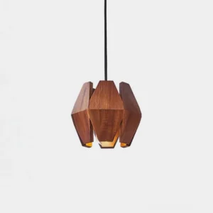 Geometric wood pendant light with polygonal walnut shade and metal accents, front studio view