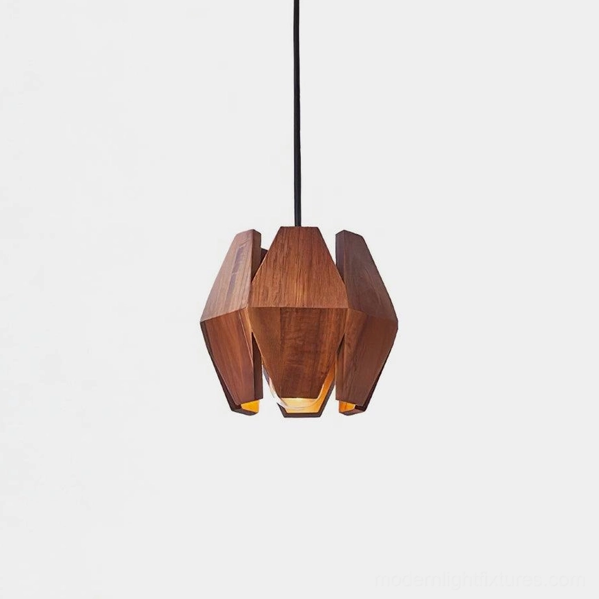 Geometric wood pendant light with polygonal walnut shade and metal accents, front studio view