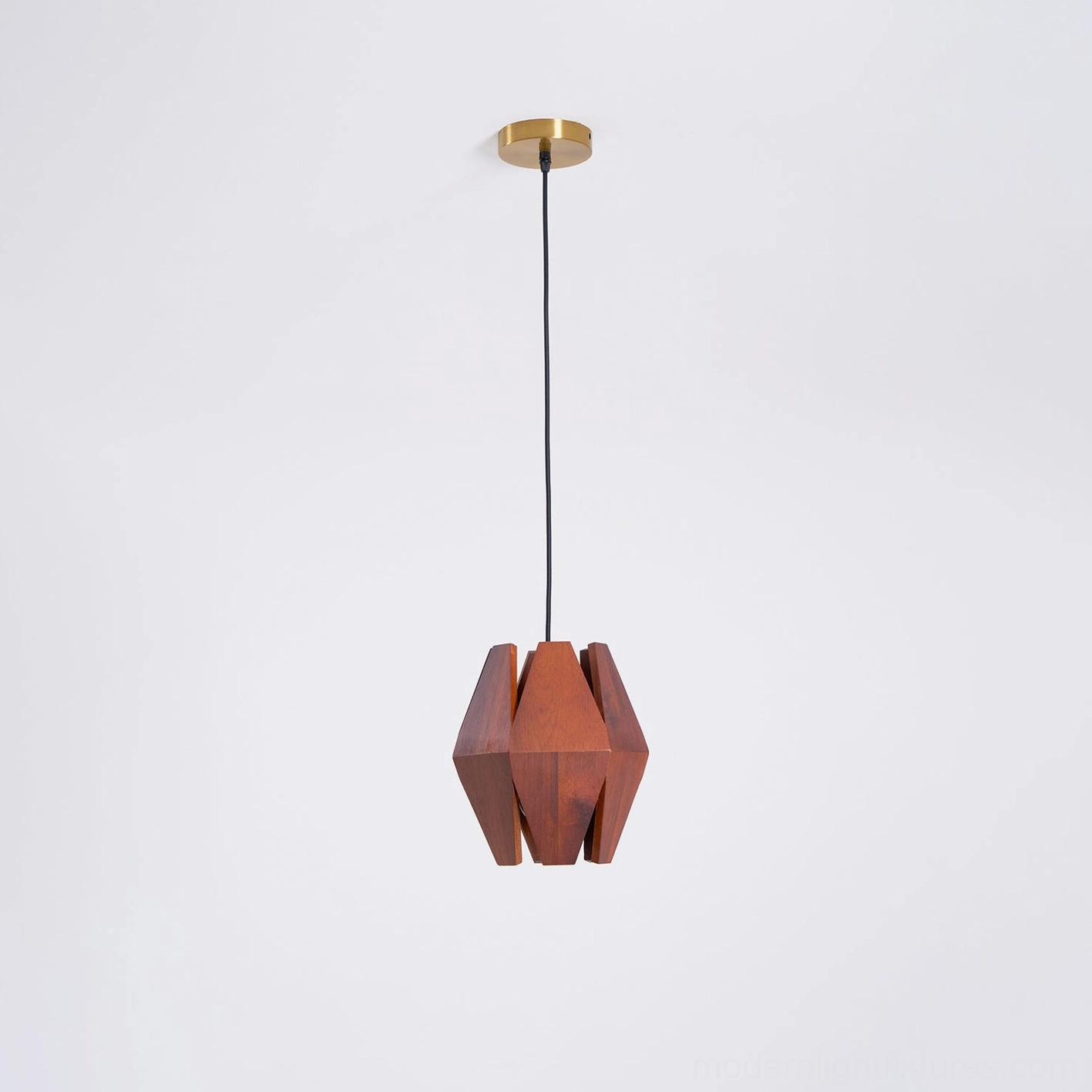 Modern geometric wood pendant lamp installed in residential interior creating focal point