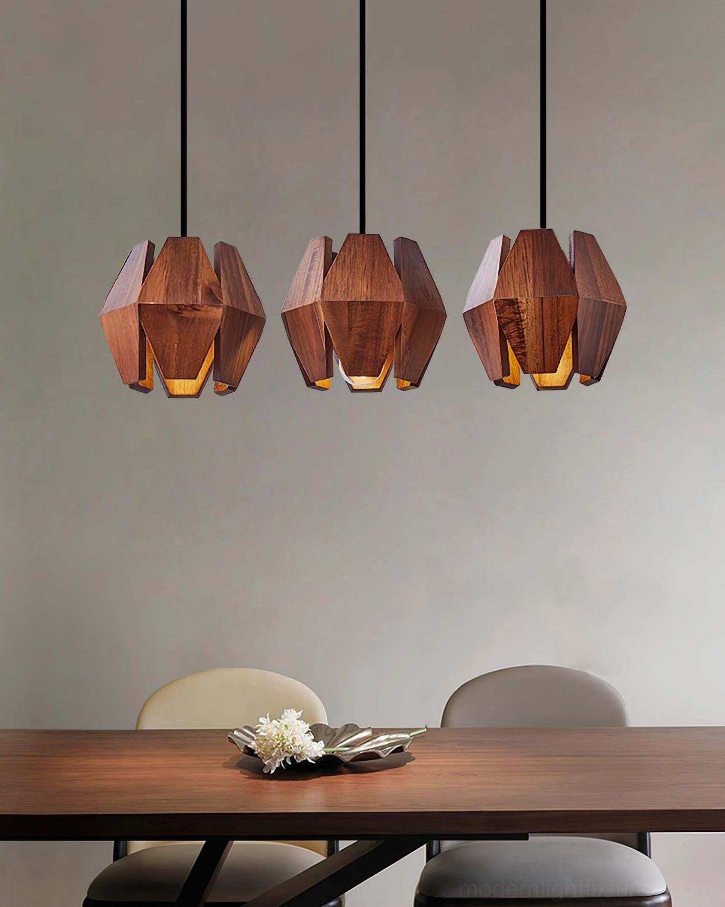 Modern geometric wood pendant lamp emitting warm ambient glow in contemporary space