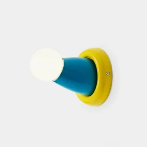 Modern geometric color-block wall sconce with yellow and blue conical design, front studio view