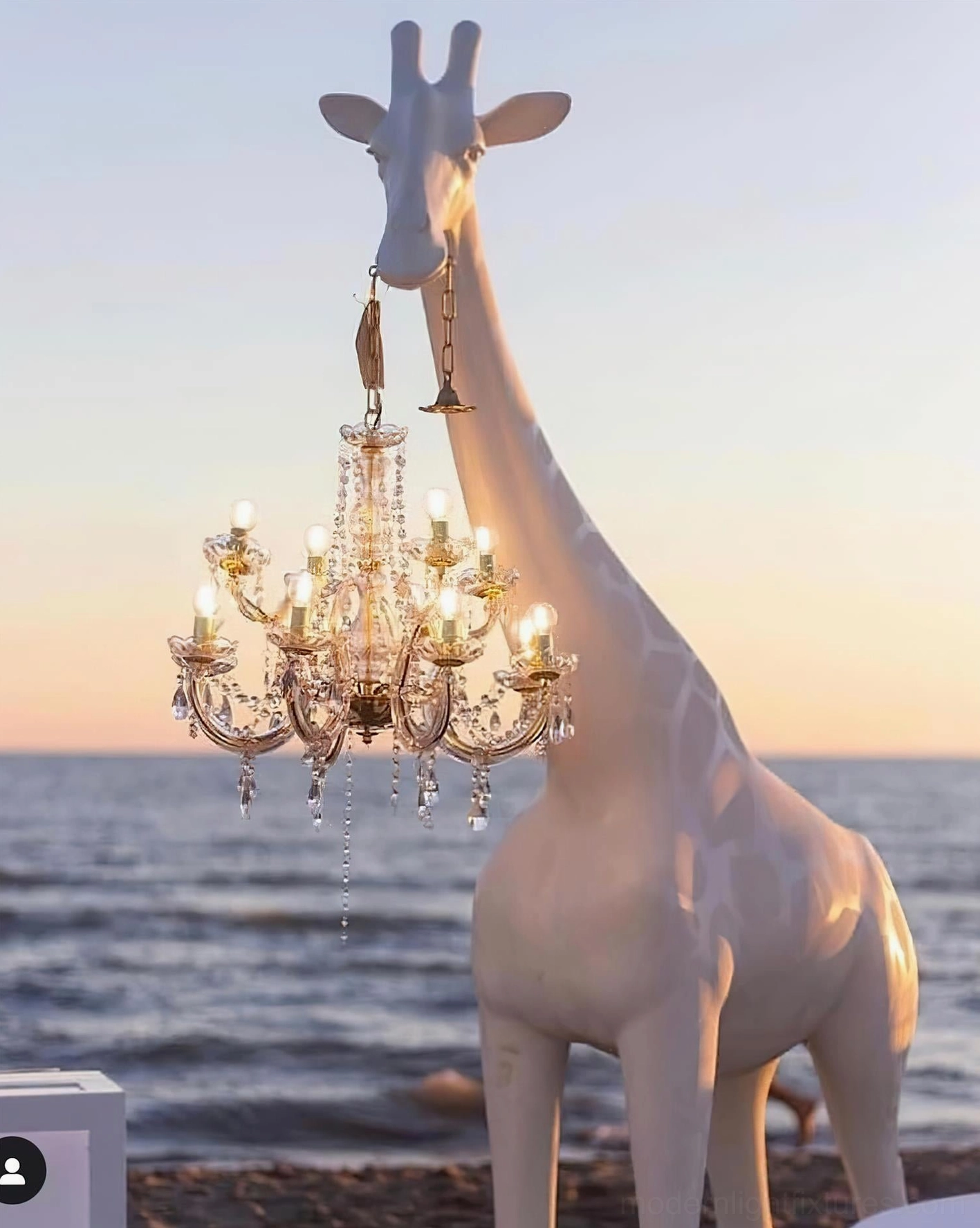 Modern giraffe floor lamp with resin sculptural body and suspended crystal pendant creating ambient illumination