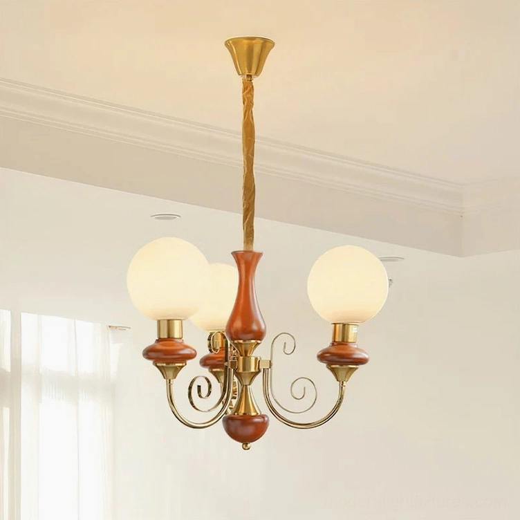 Modern glass chandelier with color-blocked design, frosted shades and gold finish