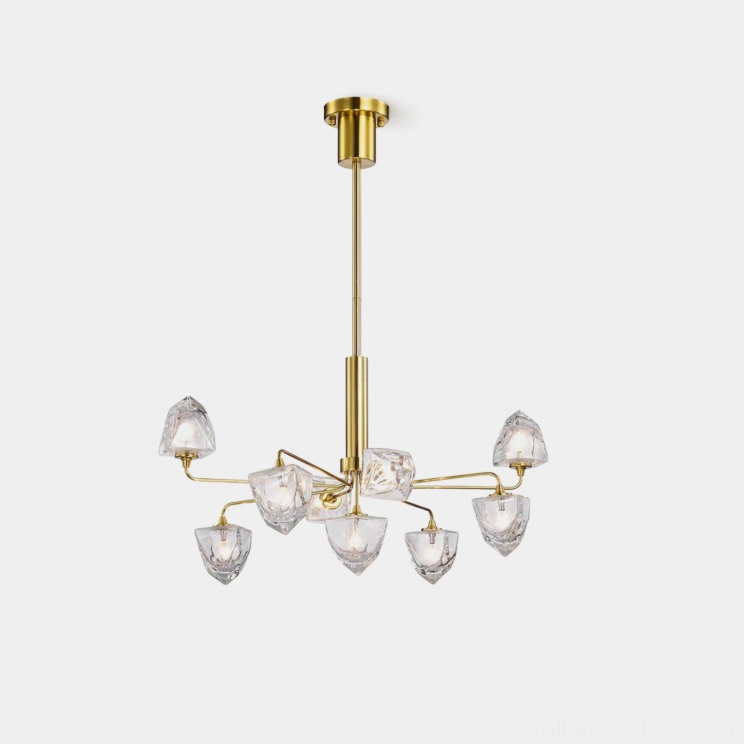 Modern glass chandelier with faceted clear shades and luxury brass gold metal frame on white studio background