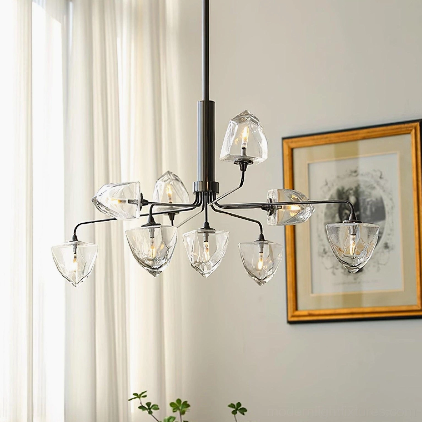 Modern glass chandelier fixture showing detailed faceted clear glass shades and metal framework