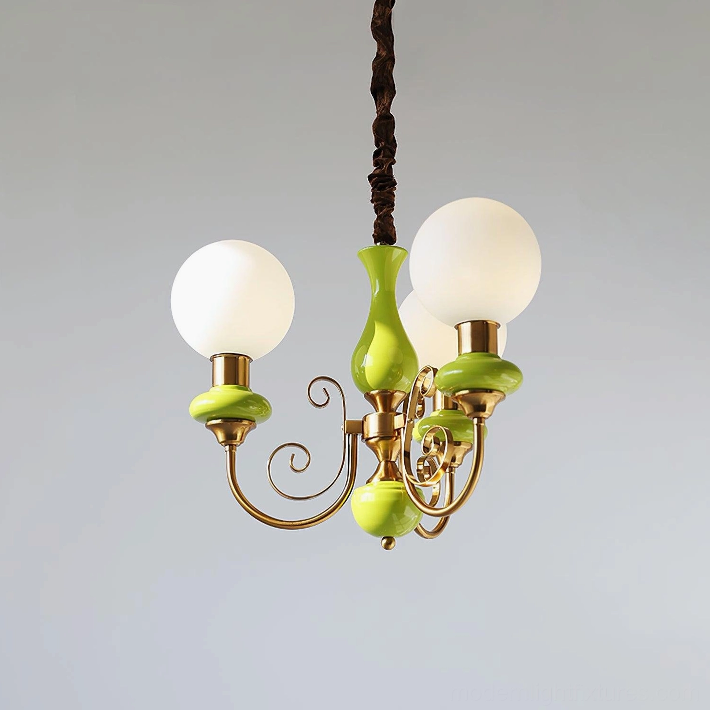 Modern glass chandelier with warm glow effect, multiple pendant spheres overhead view