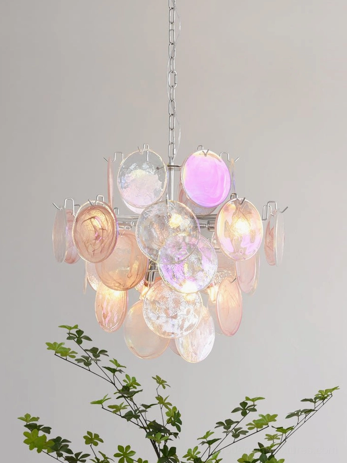 Modern glass disc chandelier positioned in contemporary living space showing statement design