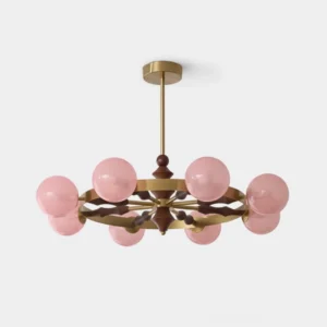 Pink frosted glass globe mid-century modern chandelier with brass and wood frame on white background