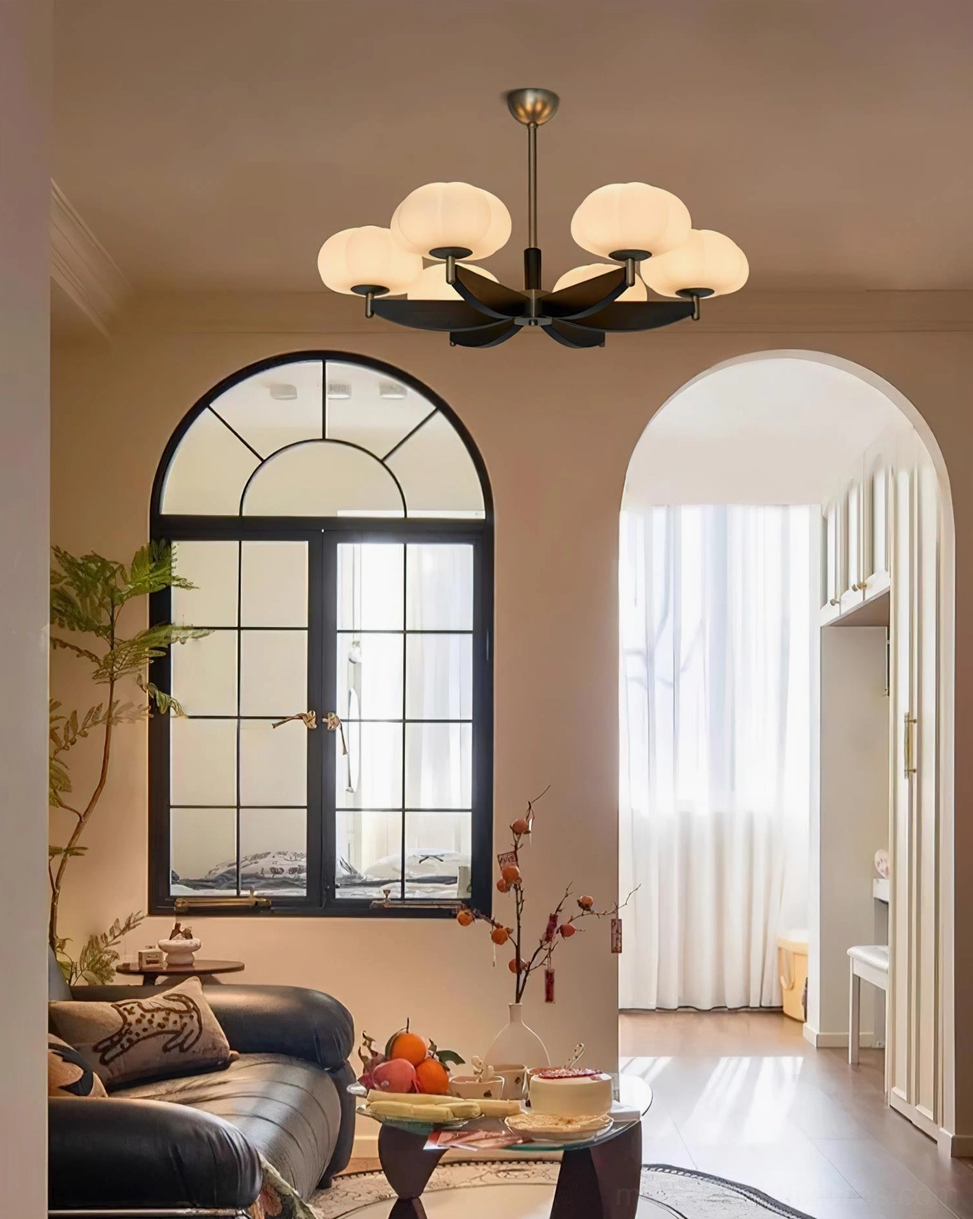 6-head vintage pumpkin glass pendant chandelier with matte black metal frame, brass trim accents, and white glass shades in retro duplex living room