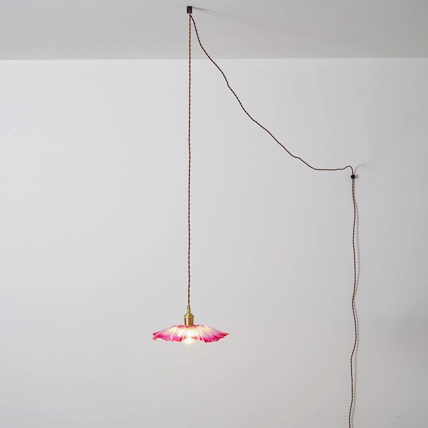 Modern glass pendant lamp with petal design and warm ambient illumination