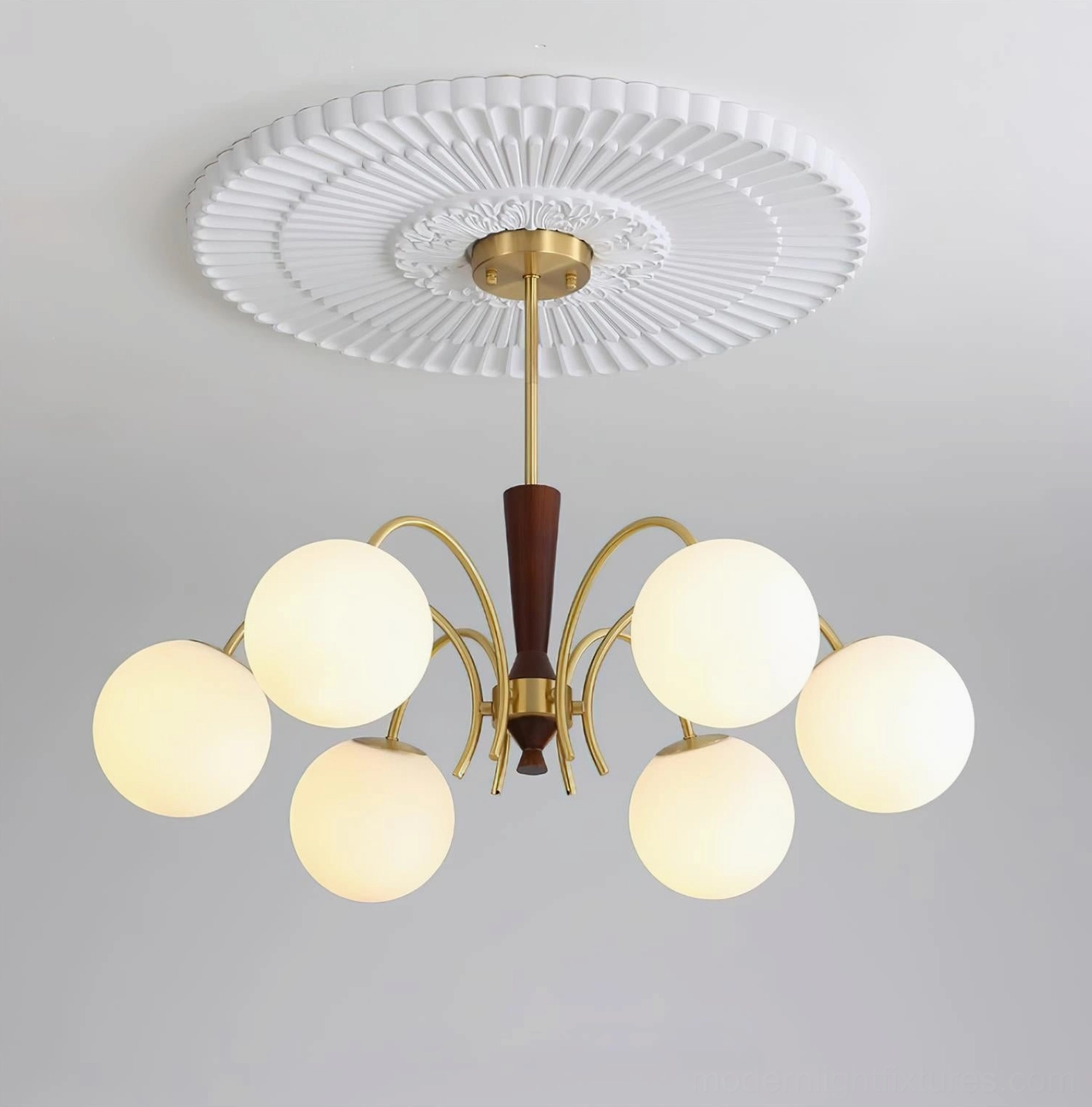 Modern globe chandelier with adjustable frosted glass shades in mid-century style brass and walnut design