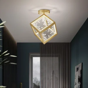 Modern gold ceiling light fixture installed in contemporary dark tone interior corner
