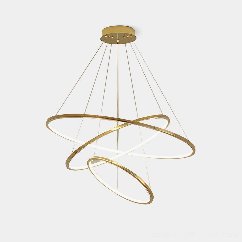 Modern gold ring chandelier with intertwined cascading rings, studio front view on white background