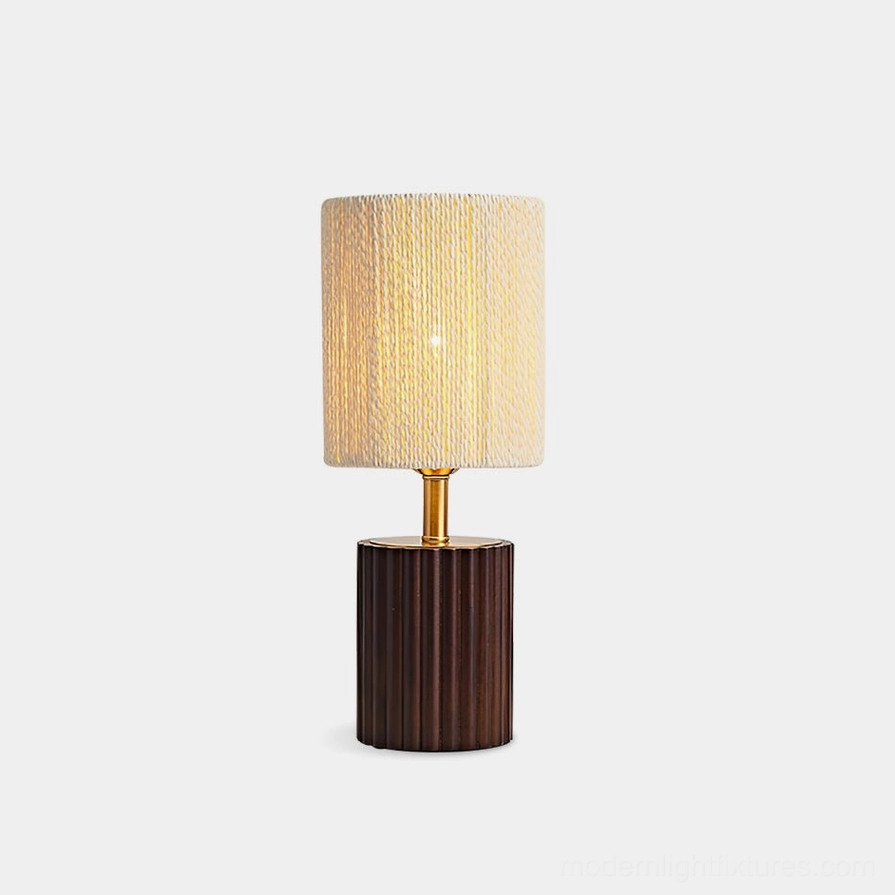 Modern grooved wood table lamp with dark walnut base and beige textured cylindrical shade, front studio view