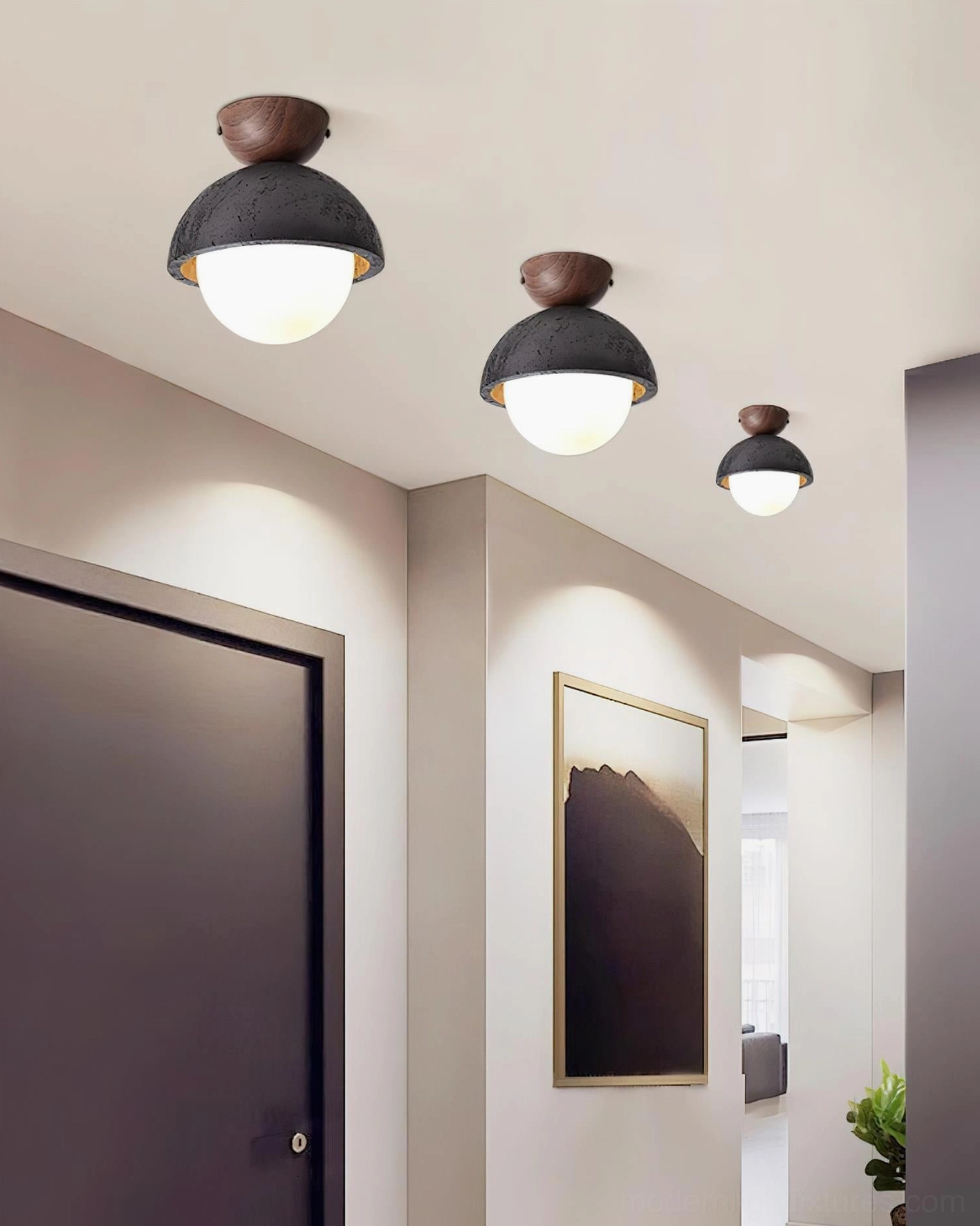 Multiple travertine ceiling light fixtures installed in modern minimalist hallway