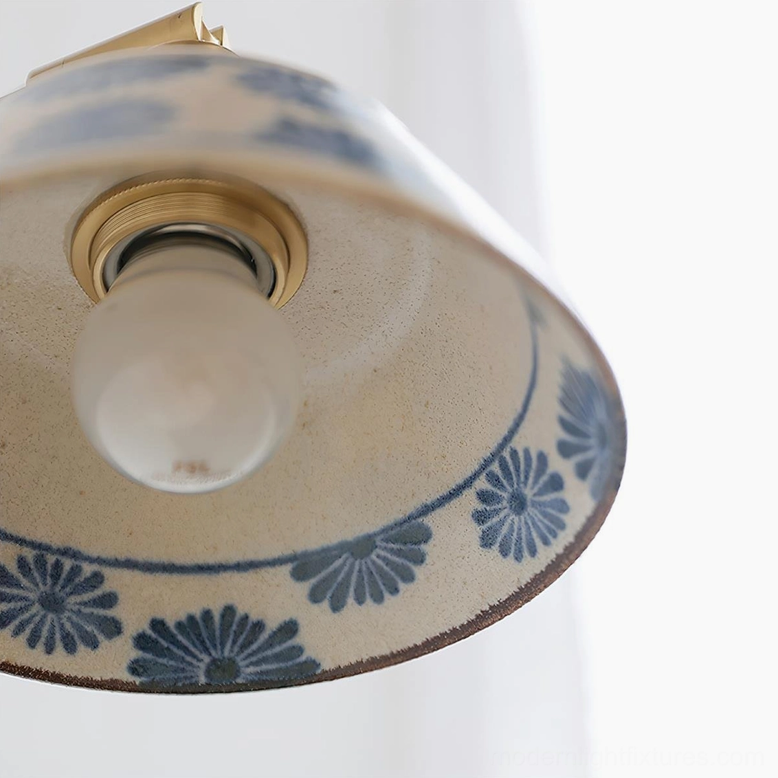 Modern ceramic wall lamp with hand-painted indigo shade and refined brass composition