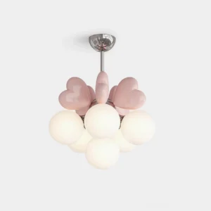 Modern heart chandelier with chrome metal base and pink resin heart accents on white studio background