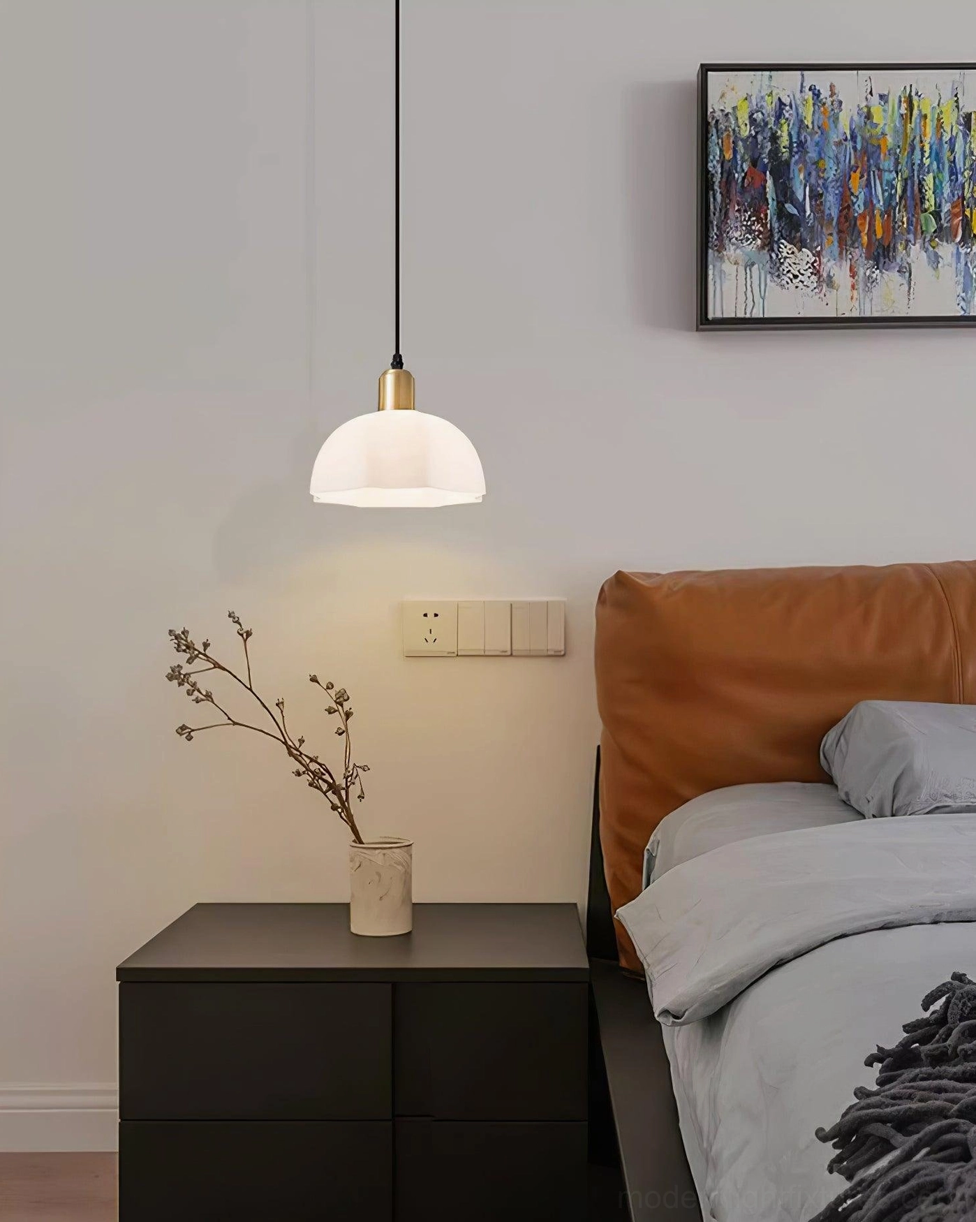 Modern master bedroom with horn pendant light eye-level view black nightstand