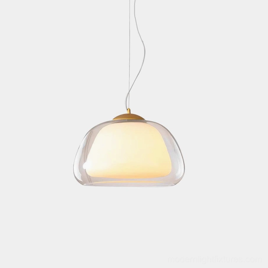 Modern jelly glass pendant light with double-layer clear and frosted shade, brass hardware, front studio view