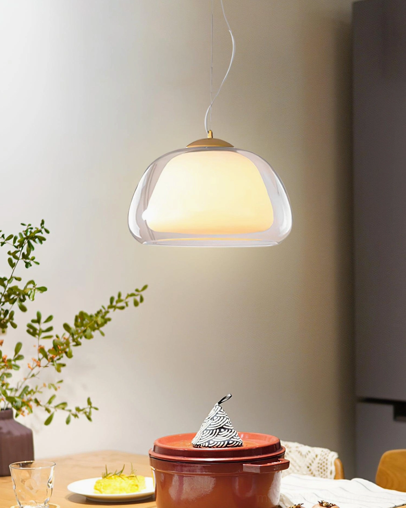 Contemporary jelly glass pendant light mounted in bright modern interior with clean lines and minimalist décor