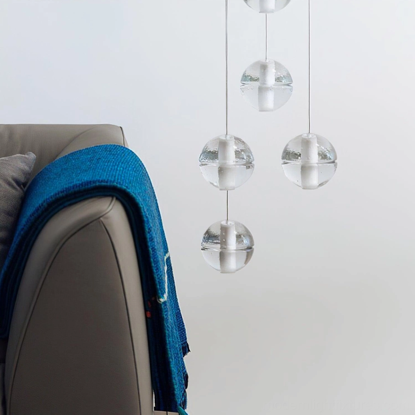 Modern K9 crystal multi-head pendant light displaying clear glass transparency and light refraction