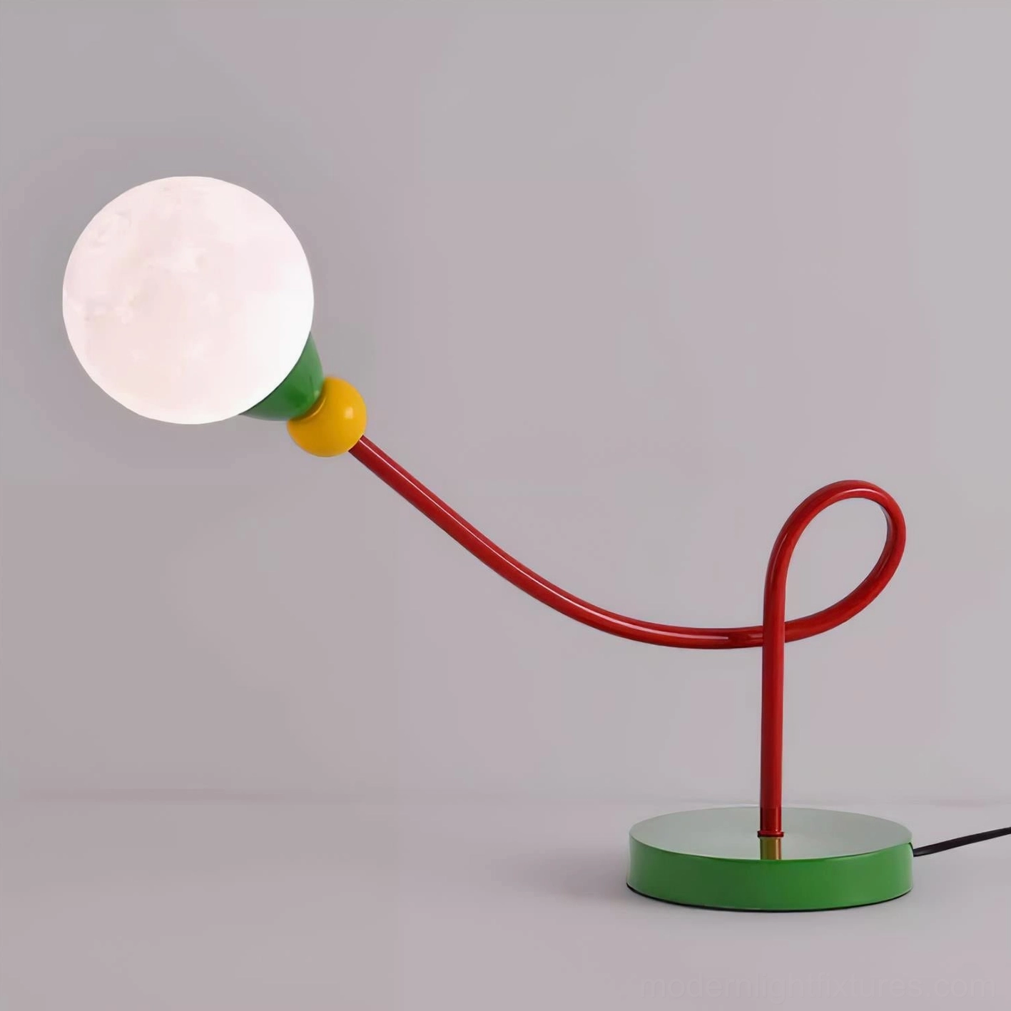 Contemporary curved metal arm table lamp detail showing craftsmanship and geometric design