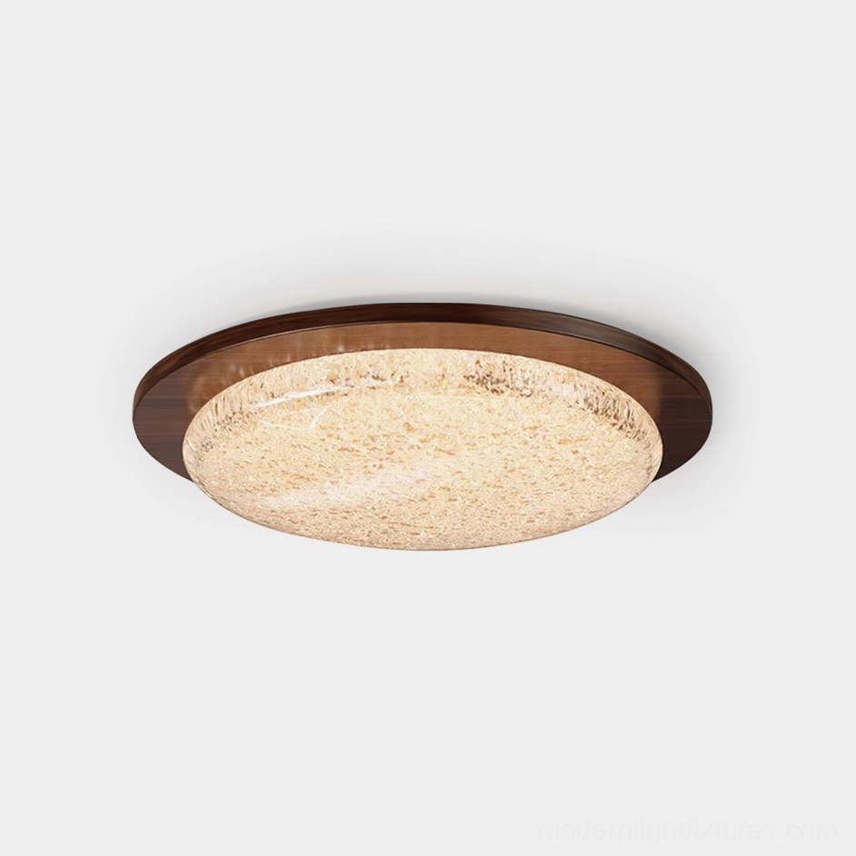 Modern LED flush mount ceiling light with walnut wooden trim and textured frosted glass diffuser - overhead studio view