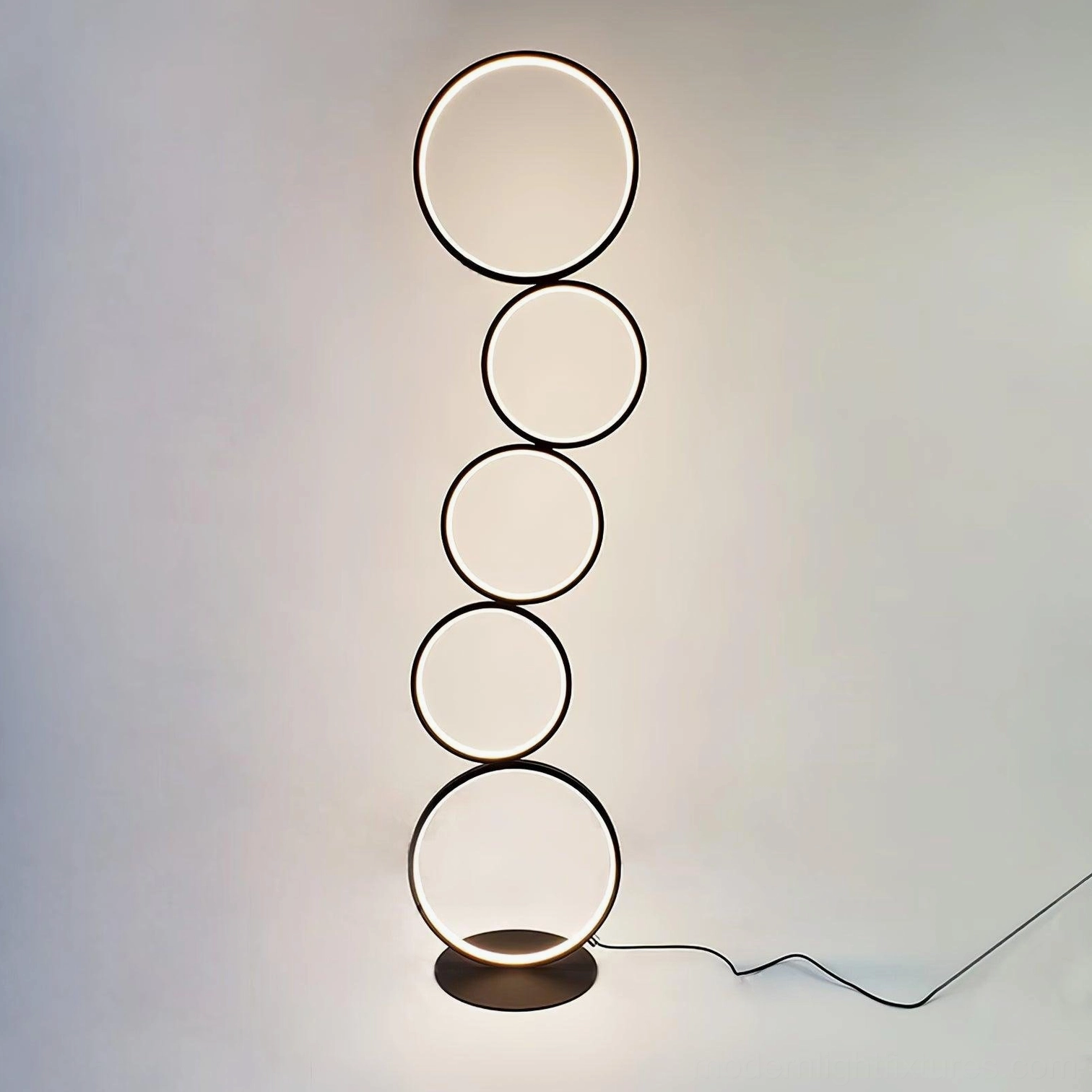 Modern LED ring floor lamp full length view illustrating sculptural presence in interior space