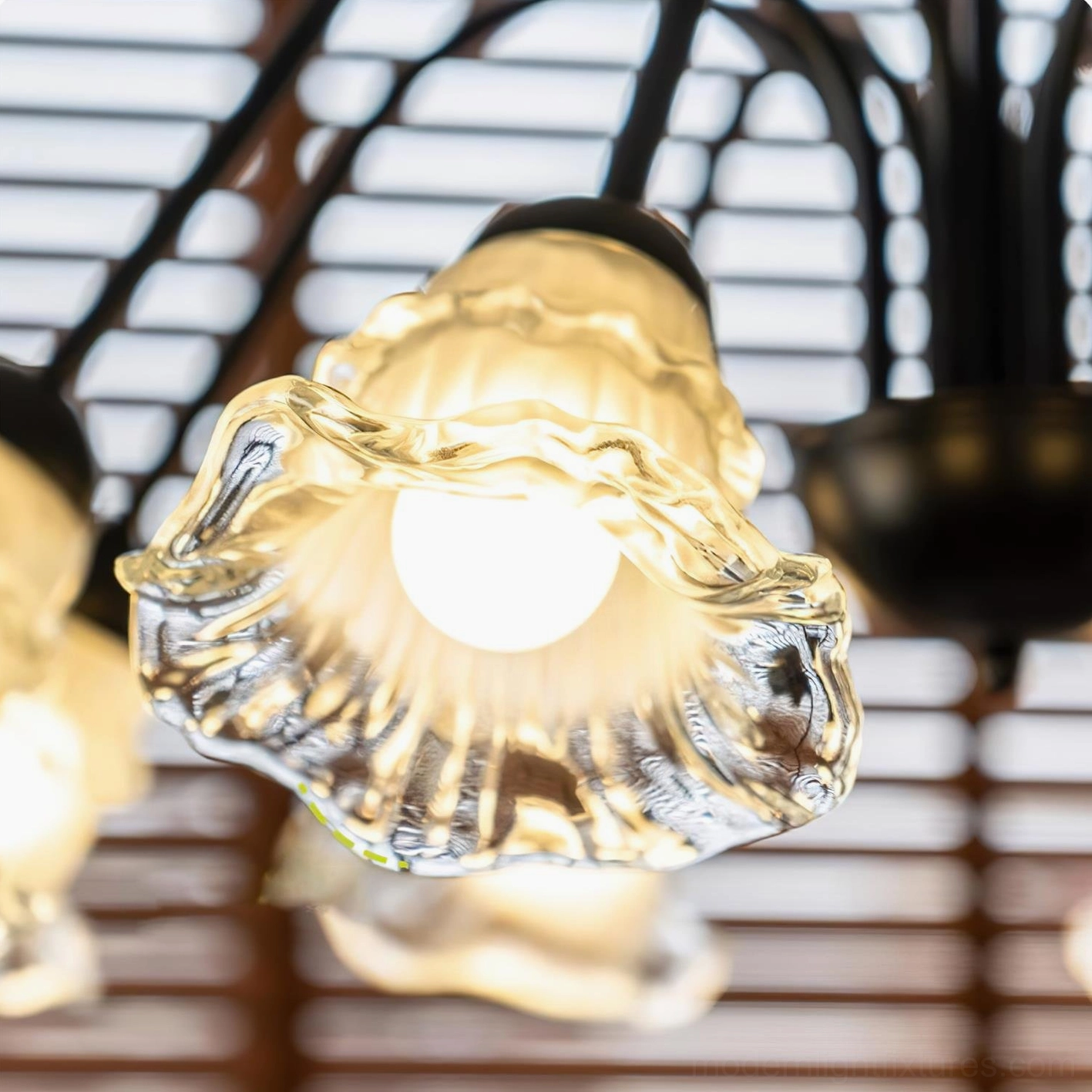 Modern Lilura floral glass chandelier with dynamic curved black metal stems and diffused lighting