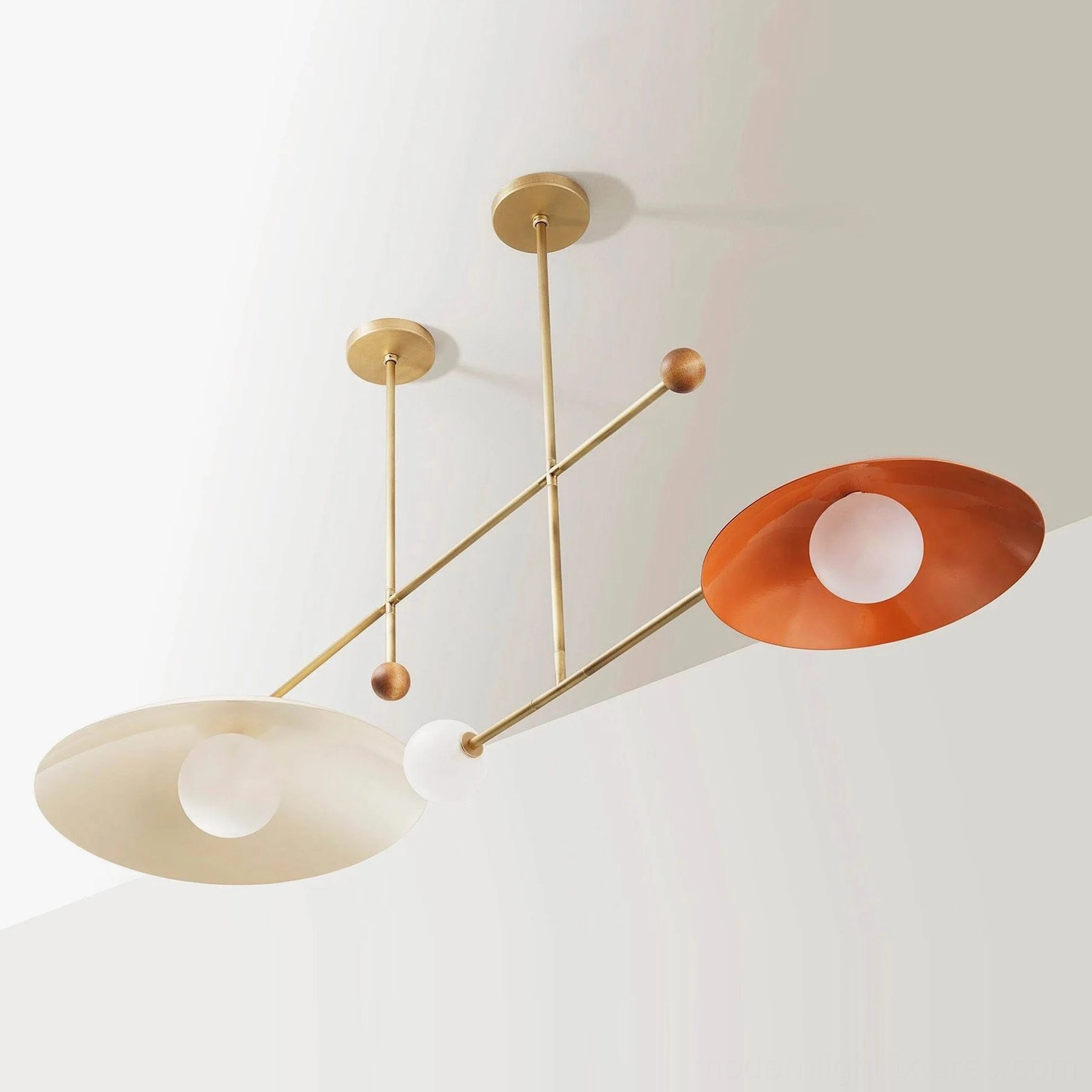 Modern linear chandelier fixture showcasing geometric design with intersecting rods and organic wood accents