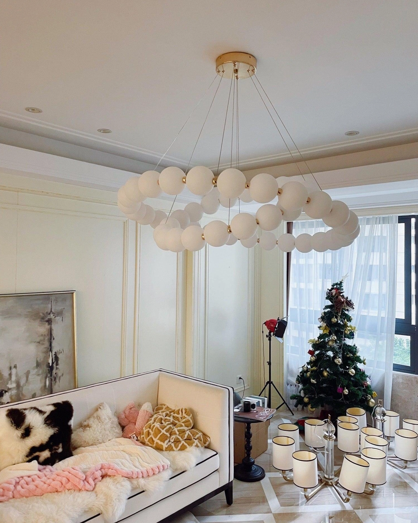 Modern luxury pearl necklace chandelier in contemporary home interior design setting