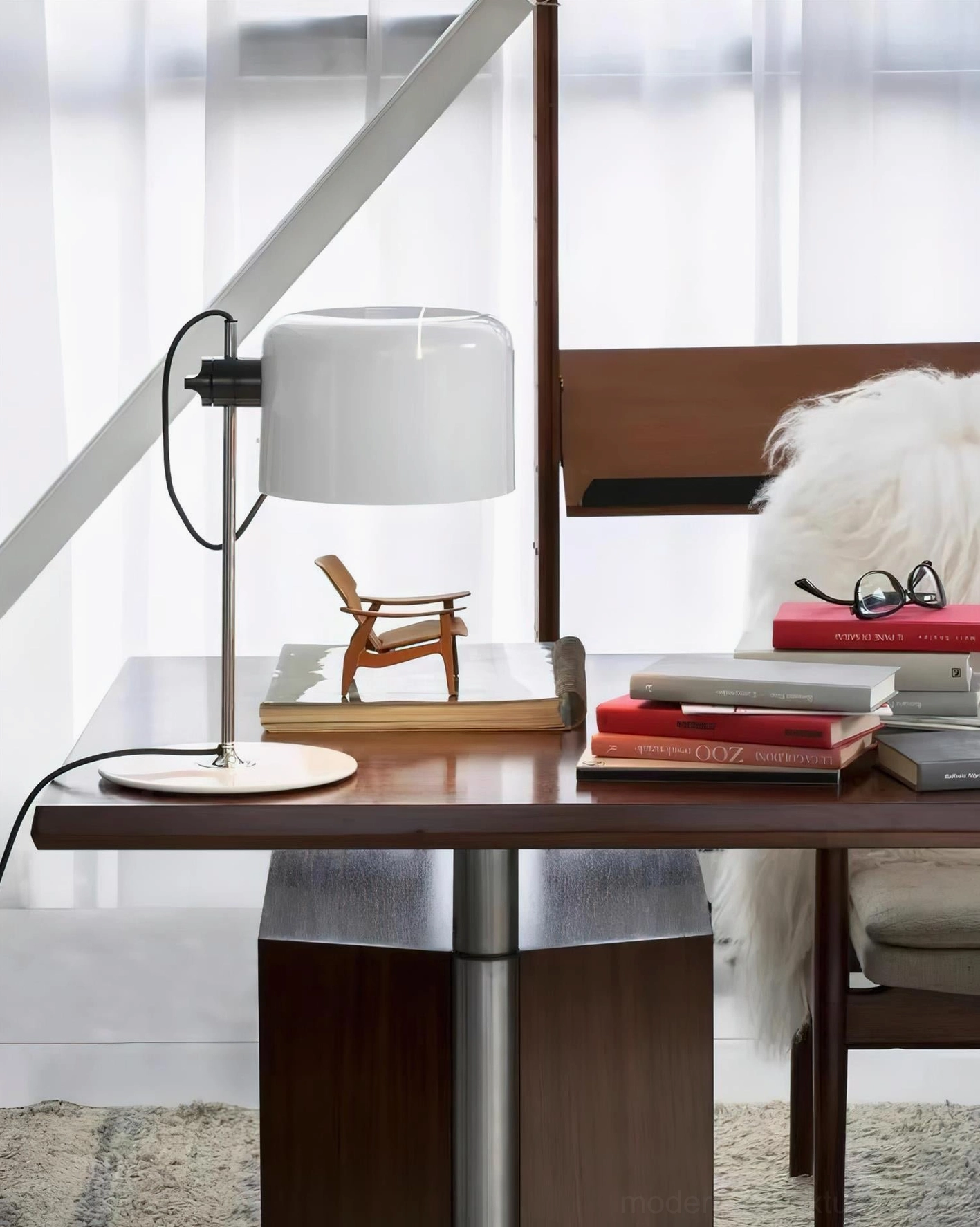 Modern desk lamp with white glossy shade on home office desk - contemporary table lamp styling